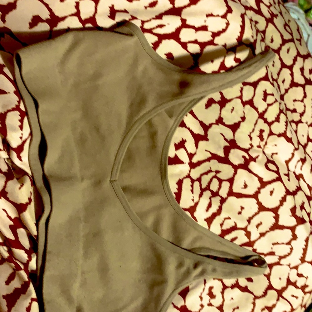It is a medium tank top a nude color